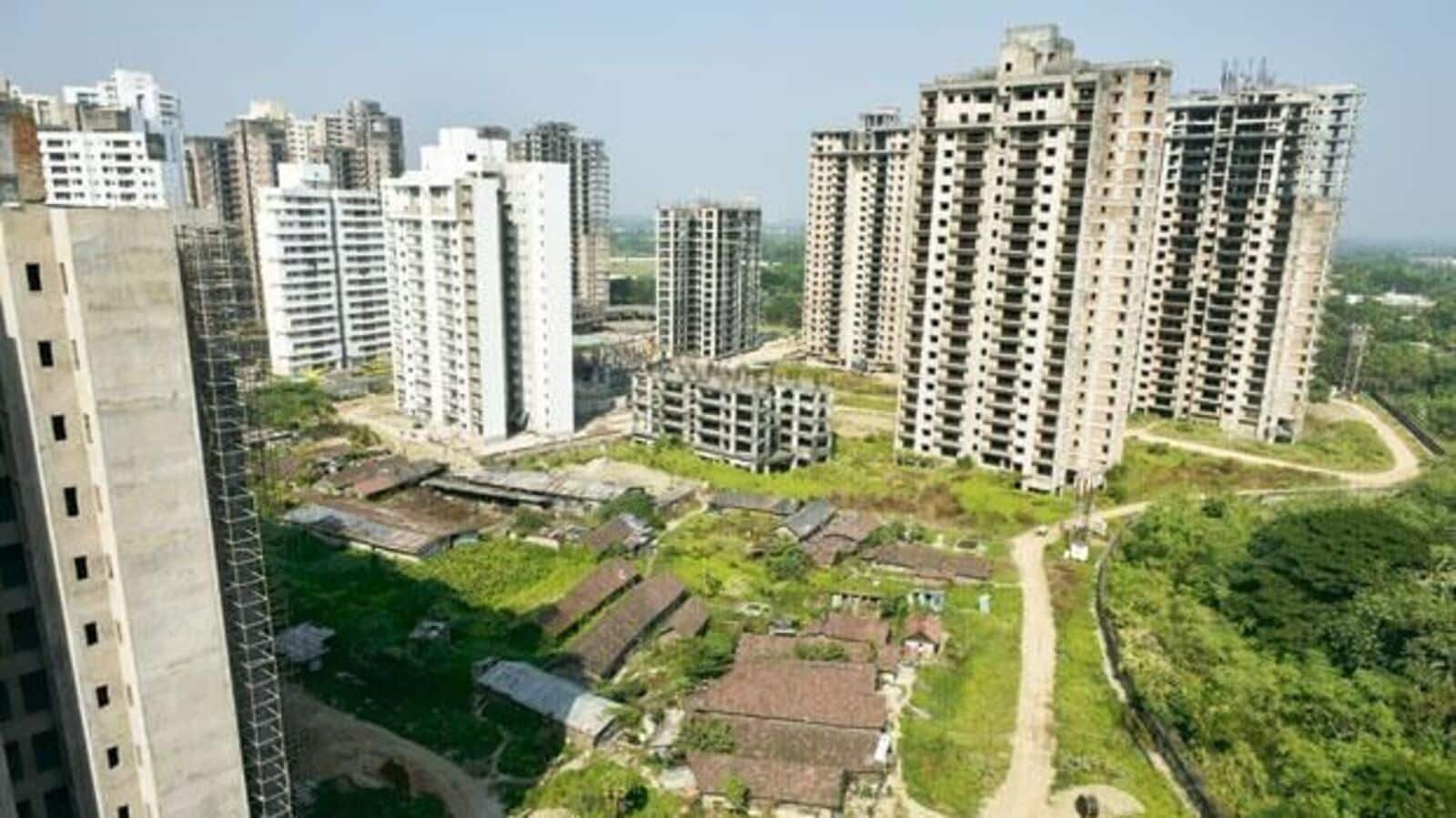 How are the profits from transferring an under-construction property before taking possession taxed? | Mint